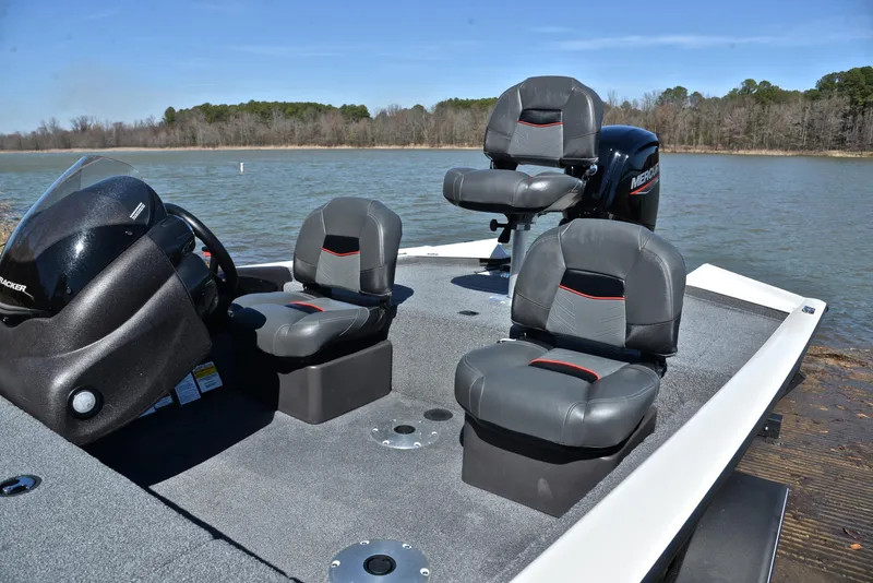 Slide: The Image of 2023 Bass Tracker PRO TEAM 175 TF boat with seating on a lake. - 18