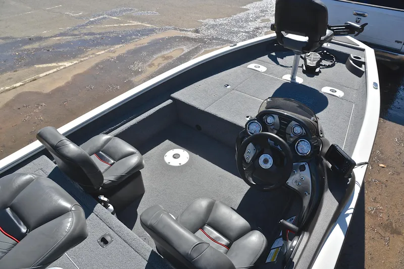 Slide: The Image of 2023 Bass Tracker PRO TEAM 175 TF boat interior with steering console and seating. - 21