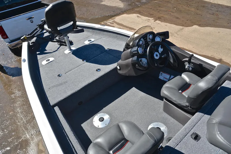 Slide: The Image of 2023 Bass Tracker PRO TEAM 175 TF boat interior with seating and steering console. - 22