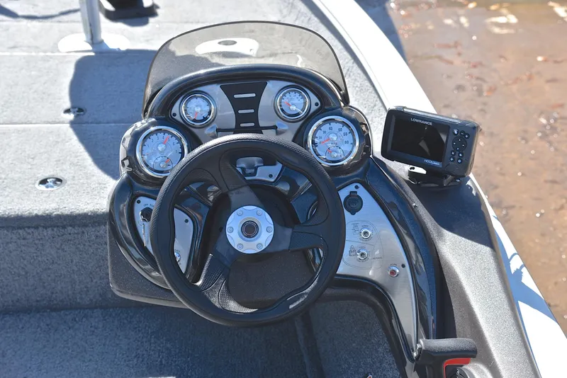 Slide: The Image of Dashboard of 2023 Bass Tracker PRO TEAM 175 TF boat with steering wheel and gauges. - 25
