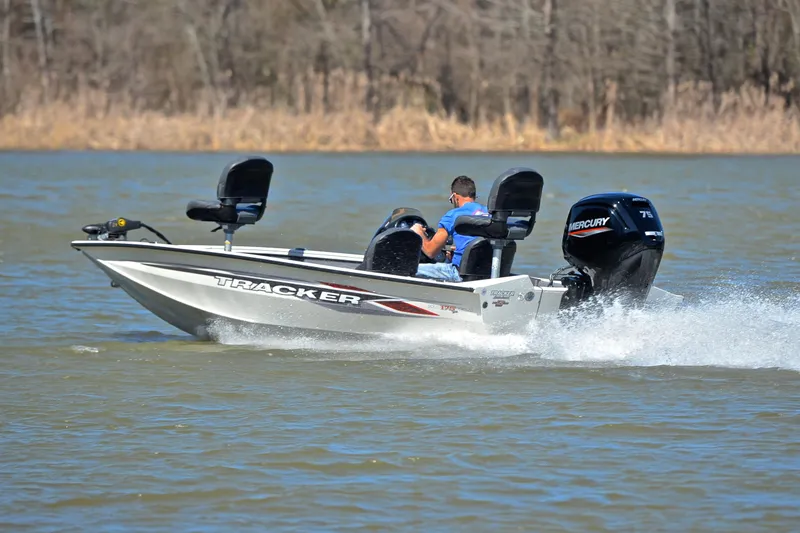 Slide: The Image of 2023 Bass Tracker PRO TEAM 175 TF boat speeding on a lake. - 4