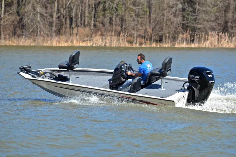 Slide: The Image of 2023 Bass Tracker PRO TEAM 175 TF boat cruising on a lake. - 6