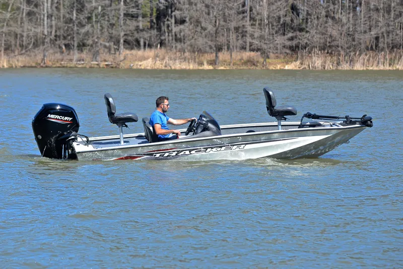 Slide: The Image of 2023 Bass Tracker PRO TEAM 175 TF boat cruising on a lake. - 7