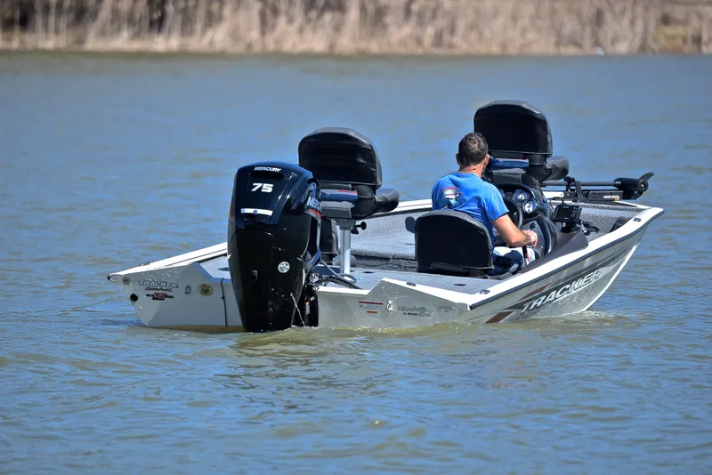 Slide: The Image of 2023 Bass Tracker PRO TEAM 175 TF boat on a lake, rear view. - 8