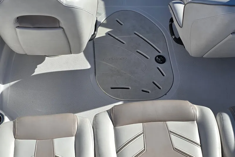Slide: The Image of Interior of 2019 Nitro Z19 Sport boat with gray seating and flooring. - 69