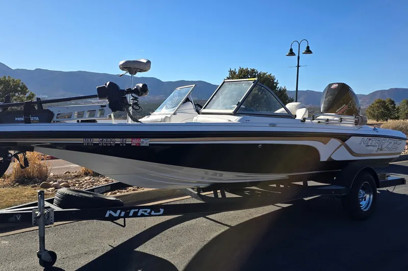 Slide: The Image of 2019 Nitro Z19 Sport boat on trailer with scenic mountain backdrop. - 71