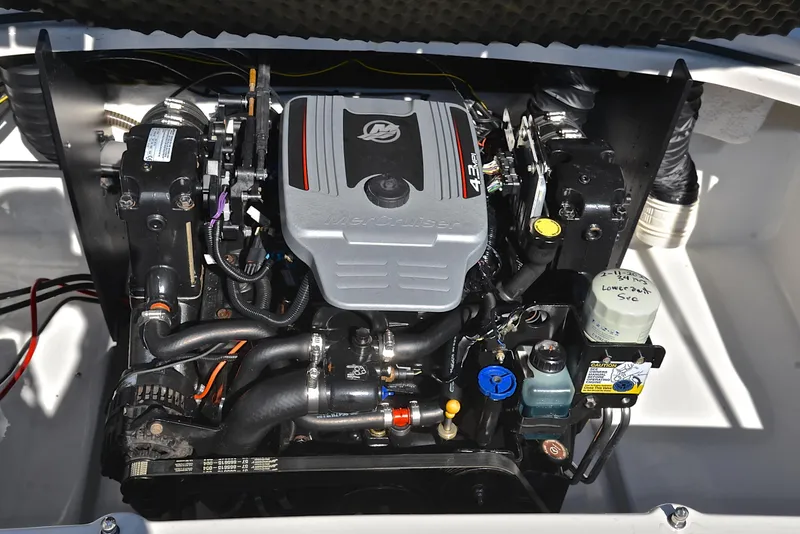 Slide: The Image of Engine compartment of a 2015 Tahoe 500 TS boat, showcasing detailed components. - 24