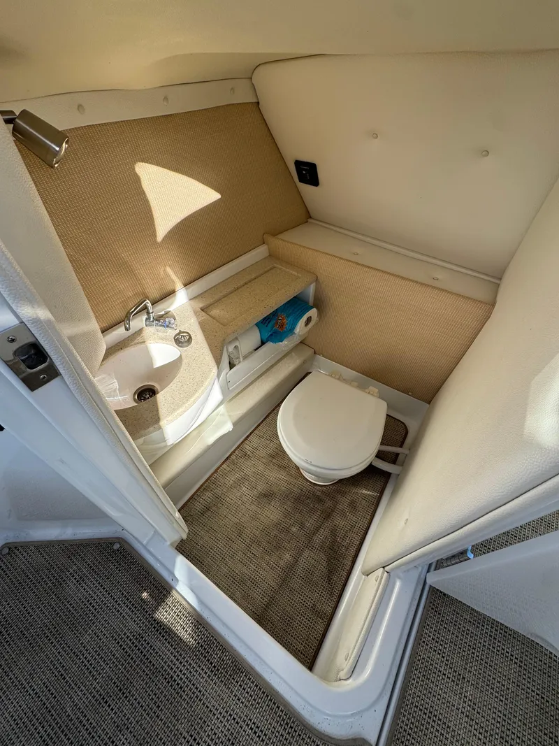 Slide: The Image of 2018 Cobalt R7 boat interior bathroom with sink and toilet. - 19