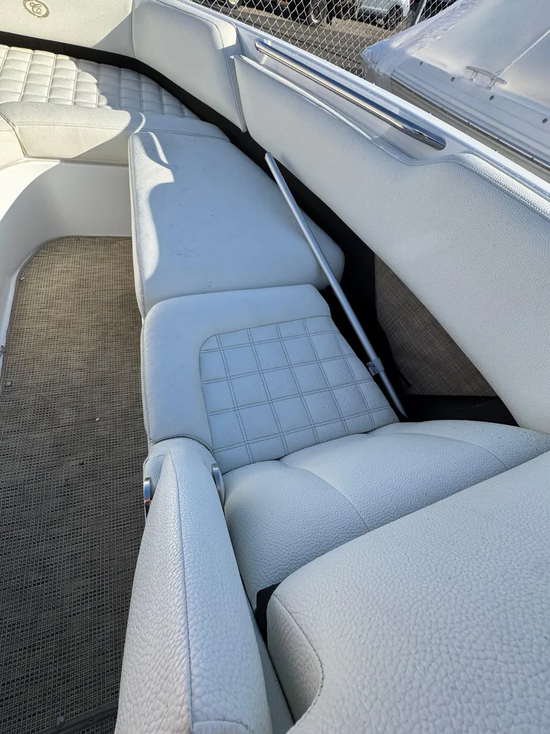 Slide: The Image of 2018 Cobalt R7 boat interior with white cushioned seating and textured flooring. - 20