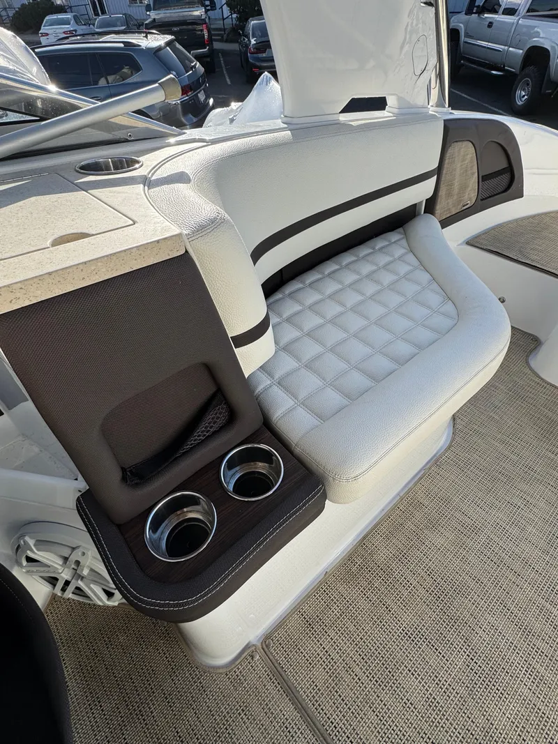Slide: The Image of 2018 Cobalt R7 boat interior with cushioned seating and dual cup holders. - 28