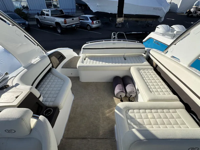 Slide: The Image of Luxurious 2018 Cobalt R7 boat interior with white cushioned seating and outdoor setting. - 29