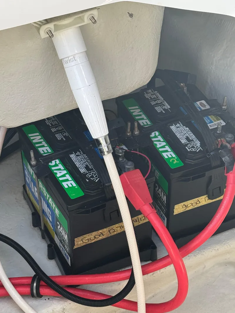 Slide: The Image of Batteries in a 2018 Cobalt R7 boat with connected cables. - 30