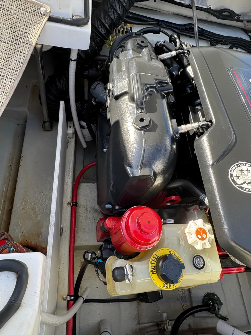 Slide: The Image of Engine compartment of a 2018 Cobalt R7 boat, featuring detailed components and wiring. - 31