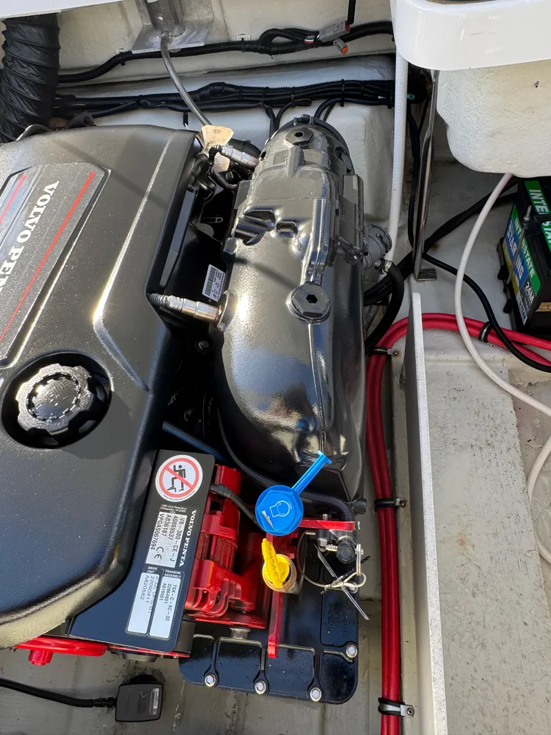 Slide: The Image of 2018 Cobalt R7 engine compartment with Volvo Penta engine and battery. - 32