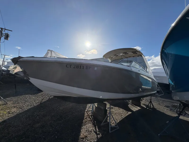 Slide: The Image of 2018 Cobalt R7 boat on stands under a bright sunlit sky. - 4