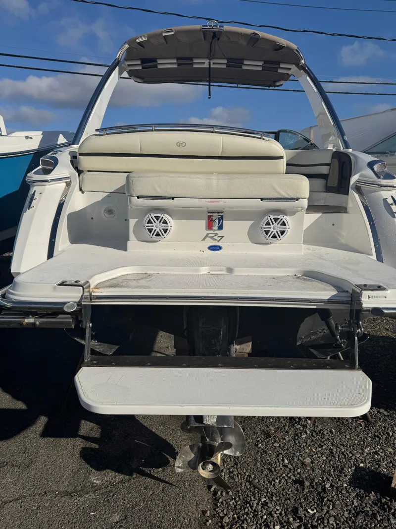 Slide: The Image of 2018 Cobalt R7 boat with swim platform and speakers, parked outdoors. - 8