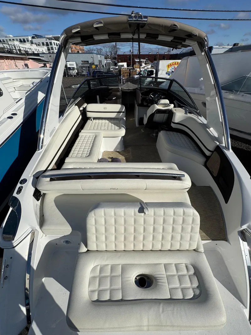 Slide: The Image of 2018 Cobalt R7 boat with white cushioned seating and open deck layout. - 9