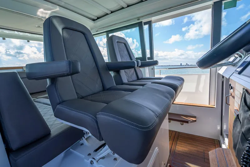 Slide: The Image of Luxurious interior seating of 2017 Axopar 37 XC Cross Cabin with ocean view. - 14