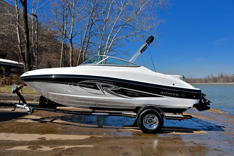 Slide: The Image of 2014 Rinker 196 Captiva boat on trailer by a lake, ready for launch. - 11