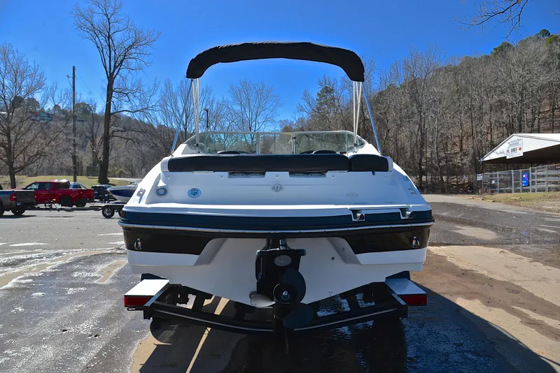 Slide: The Image of 2014 Rinker 196 Captiva boat on trailer, rear view, outdoors. - 13
