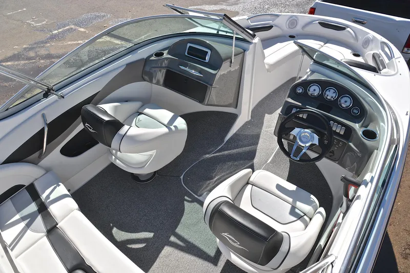 Slide: The Image of 2014 Rinker 196 Captiva boat interior with modern dashboard and seating. - 19