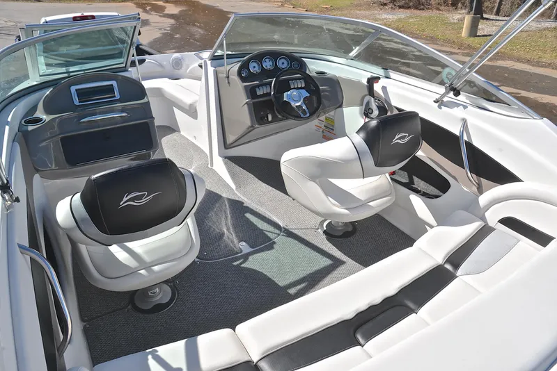 Slide: The Image of 2014 Rinker 196 Captiva boat interior with modern dashboard and seating. - 23