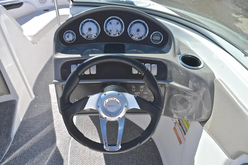 Slide: The Image of 2014 Rinker 196 Captiva boat dashboard with steering wheel and gauges. - 25