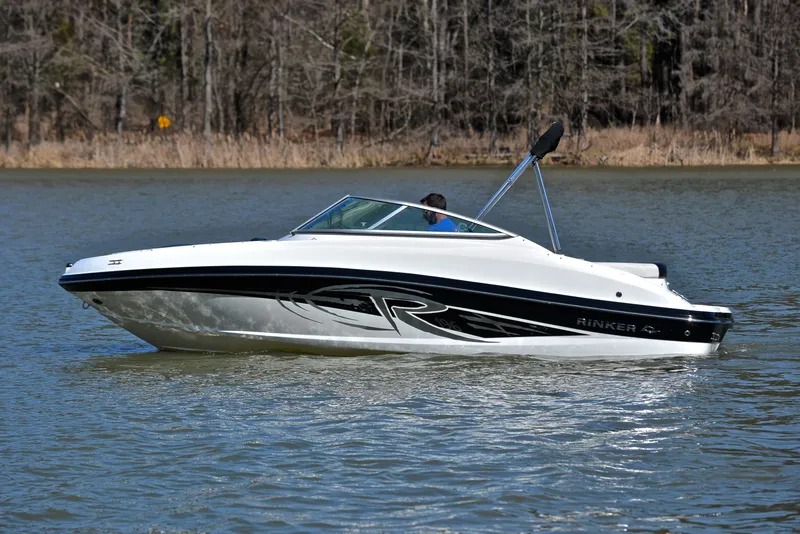 Slide: The Image of 2014 Rinker 196 Captiva boat cruising on a calm lake. - 9