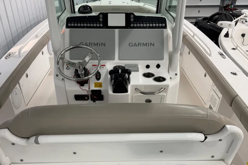 Slide: The Image of 2019 Everglades 273 Center Console boat interior with Garmin navigation system. - 2