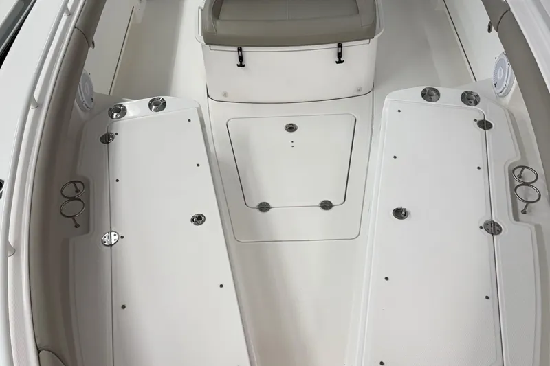 Slide: The Image of 2019 Everglades 273 Center Console boat interior with seating and storage compartments. - 7