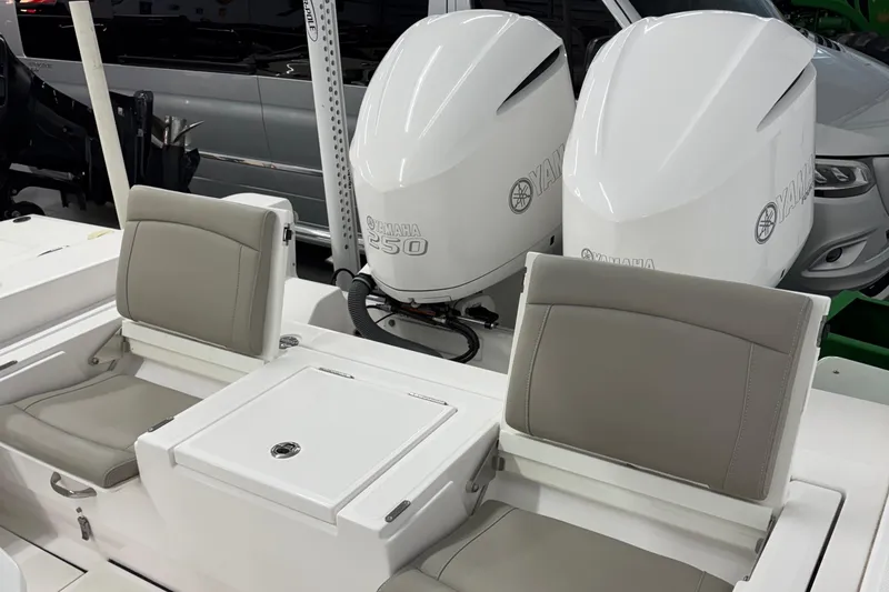 Slide: The Image of 2019 Everglades 273 Center Console boat with twin Yamaha 350 engines, featuring comfortable seating. - 8