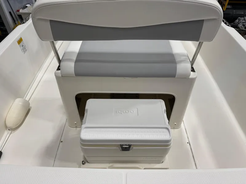 Slide: The Image of Boston Whaler 210 Dauntless 2014 boat seat with cooler storage underneath. - 14