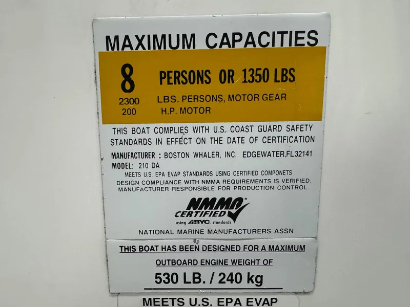 Slide: The Image of 2014 Boston Whaler 210 Dauntless capacity label: 8 persons or 1350 lbs, 2300 lbs motor gear. - 21