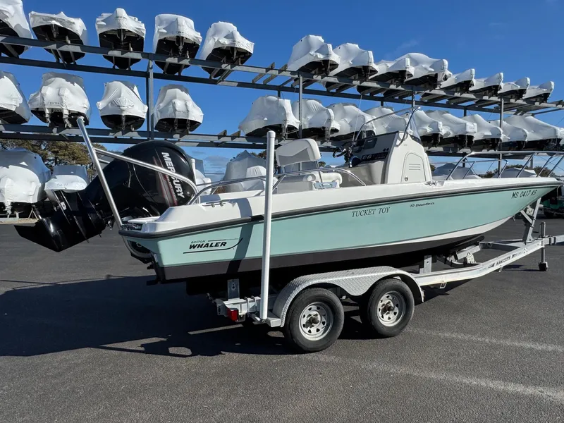 Slide: The Image of 2014 Boston Whaler 210 Dauntless boat on trailer, parked in marina storage. - 4