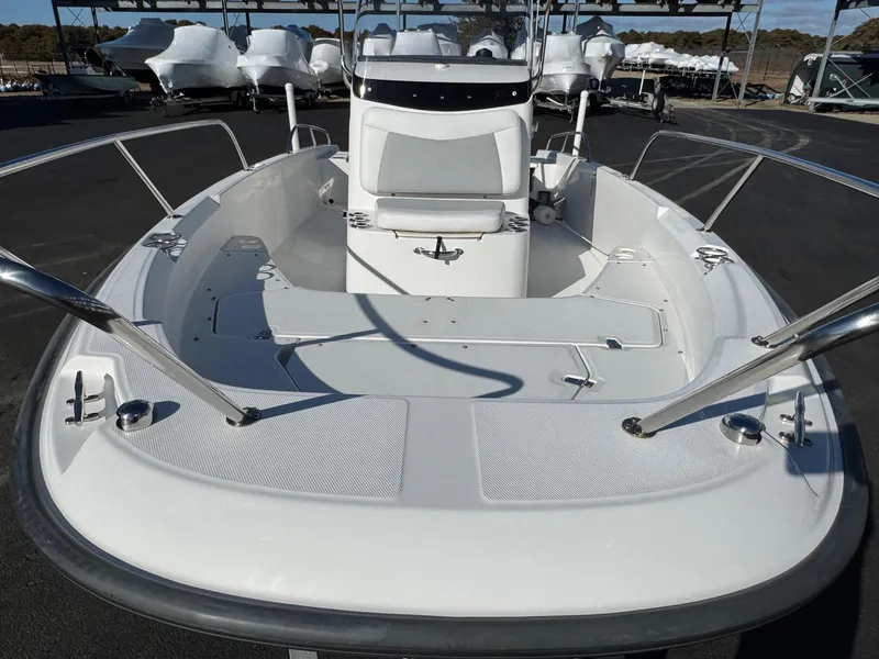 Slide: The Image of 2014 Boston Whaler 210 Dauntless boat, spacious deck, sleek design, ideal for fishing and leisure. - 5