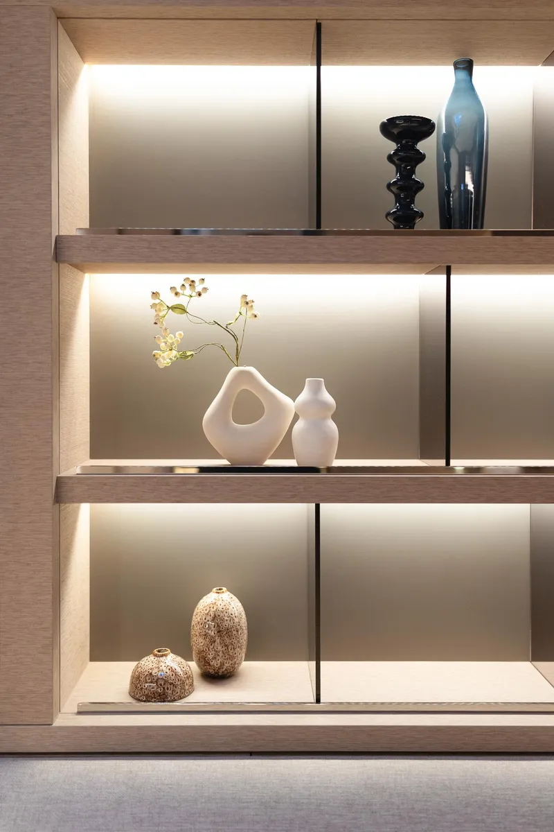 Slide: The Image of Modern shelving with decorative vases and lighting on Lagoon SIXTY 5, 2025 model. - 27