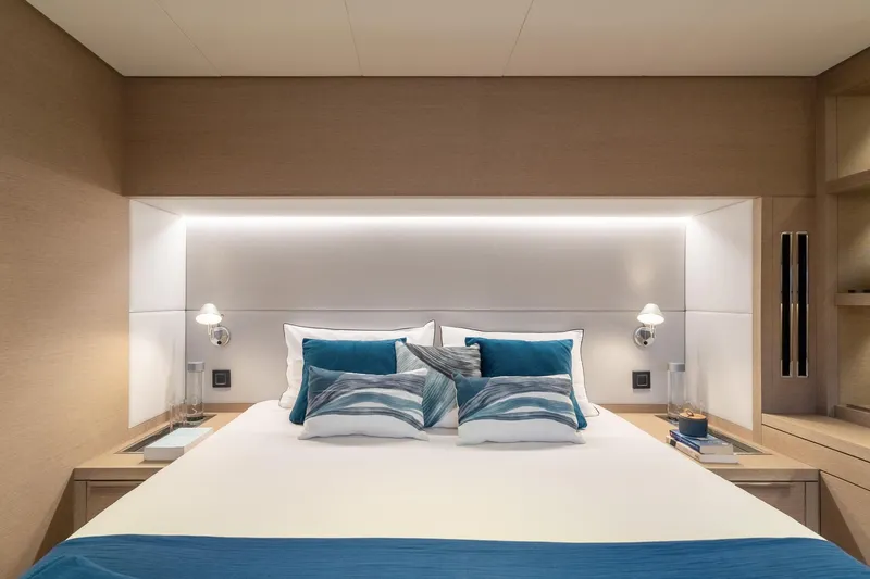 Slide: The Image of Luxurious bedroom interior of 2025 Lagoon SIXTY 5 yacht with modern design and ambient lighting. - 31