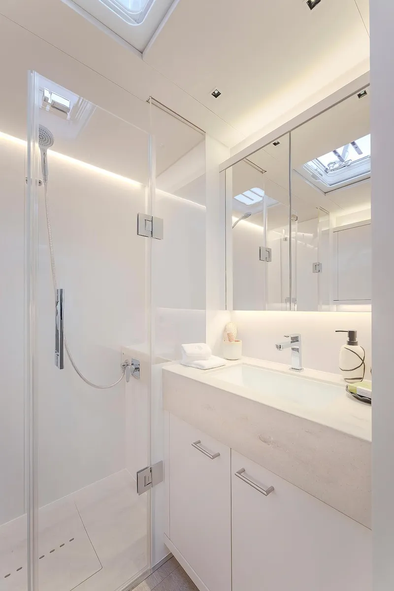 Slide: The Image of Luxurious bathroom in 2025 Lagoon SIXTY 5 yacht with modern fixtures and skylight. - 37