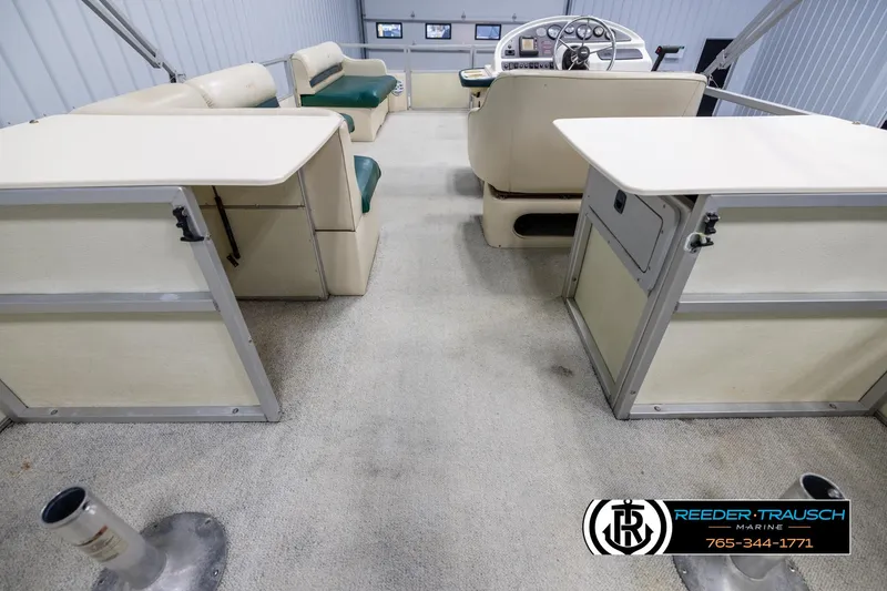 Slide: The Image of Interior of a 1998 Crest 22 DLX pontoon boat with seating and helm. - 16