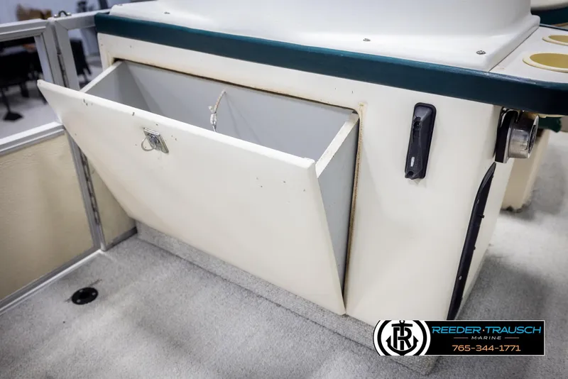 Slide: The Image of Storage compartment on a 1998 Crest 22 DLX boat, open and accessible. - 21