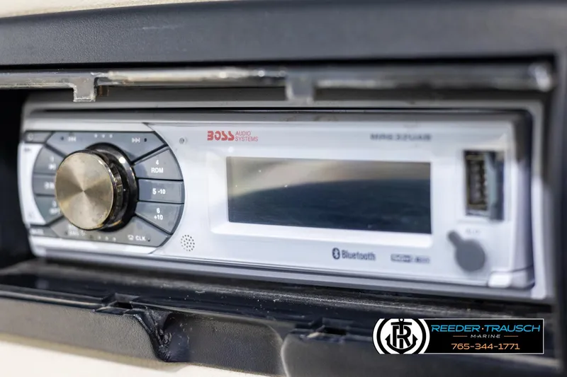 Slide: The Image of Close-up of a Boss audio stereo system in a 1998 Crest 22 DLX boat. - 25