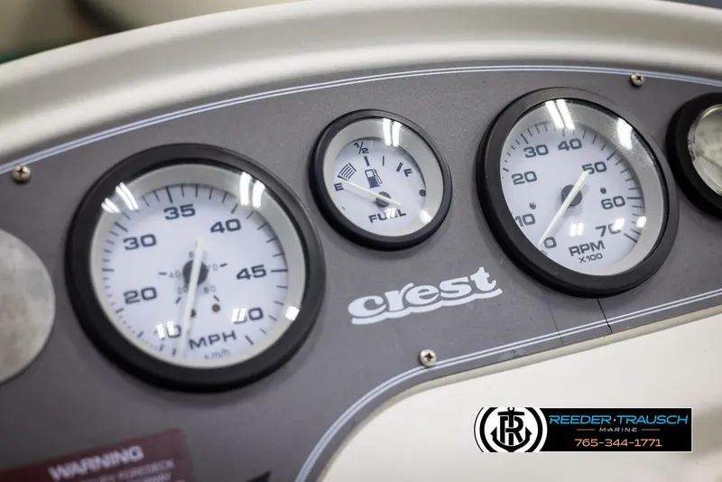 Slide: The Image of Dashboard of a 1998 Crest 22 DLX boat with speedometer and fuel gauge. - 28