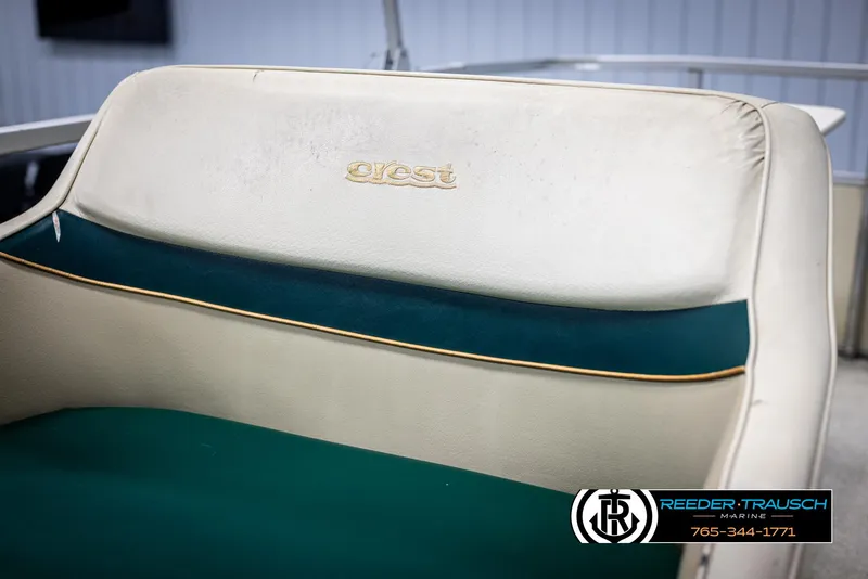 Slide: The Image of Crest 22 DLX 1998 boat seat with green and beige upholstery. - 31