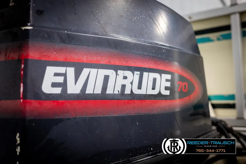 Slide: The Image of Evinrude 70 outboard motor on a 1998 Crest 22 DLX boat. - 38