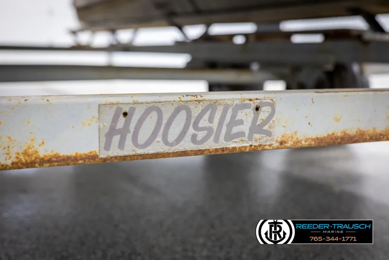 Slide: The Image of Rusty Hoosier trailer frame, Crest 22 DLX 1998, Reeder-Trausch Marine logo visible. - 42