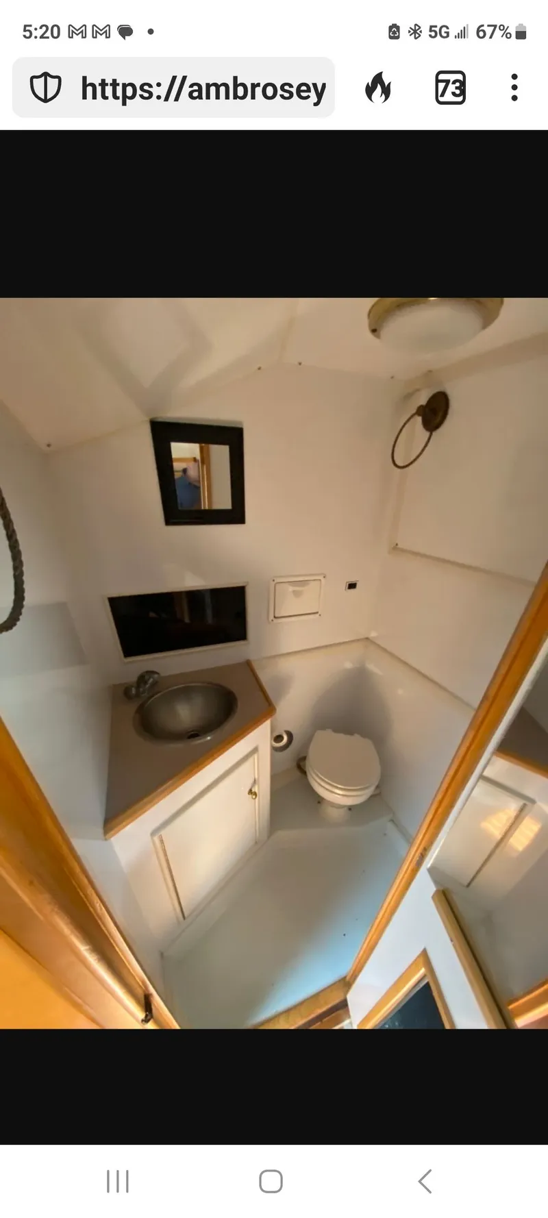 Slide: The Image of Compact bathroom in 2000 Dawson Yachts 33 EXPRESS, featuring sink, toilet, and mirror. - 10