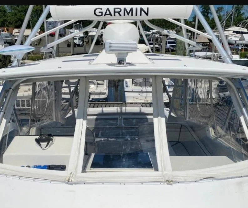 Slide: The Image of Dawson Yachts 33 EXPRESS 2000 with Garmin equipment, docked at a marina. - 18