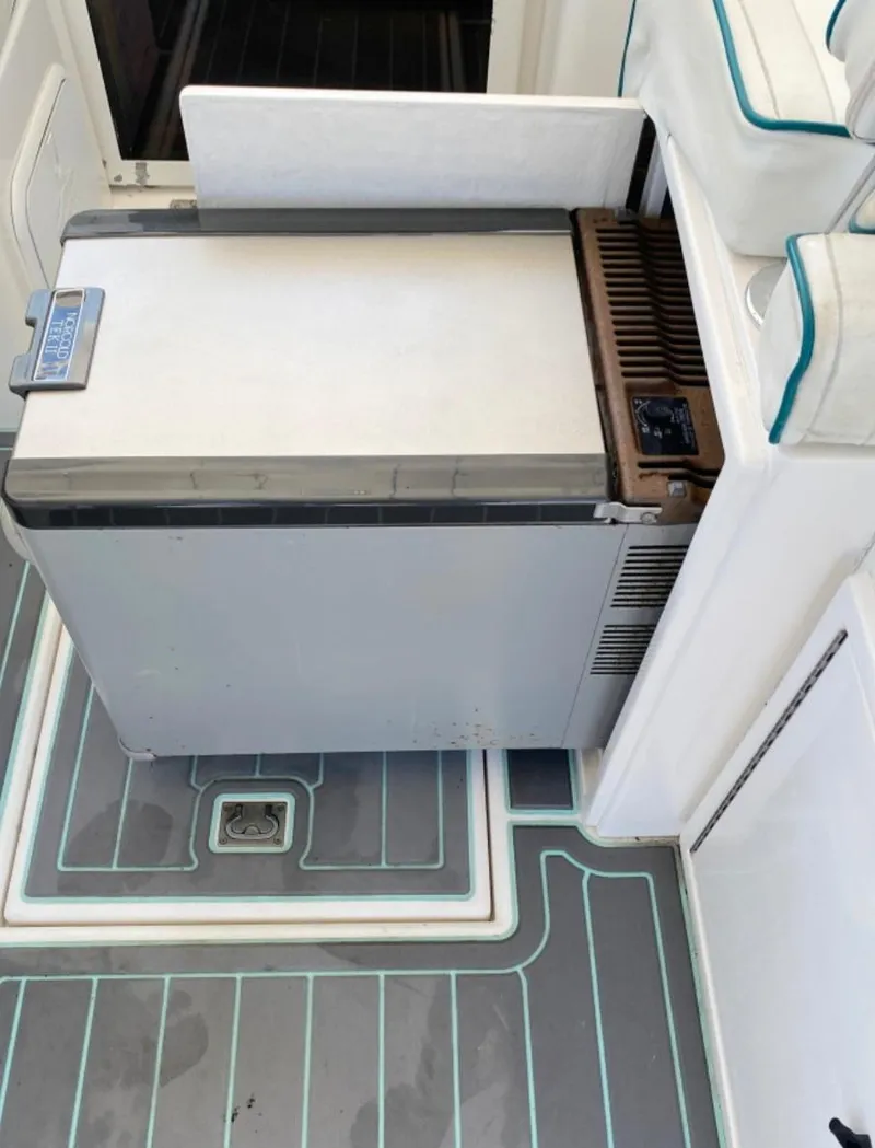 Slide: The Image of Compact refrigerator on Dawson Yachts 33 EXPRESS 2000, with sleek deck flooring. - 19