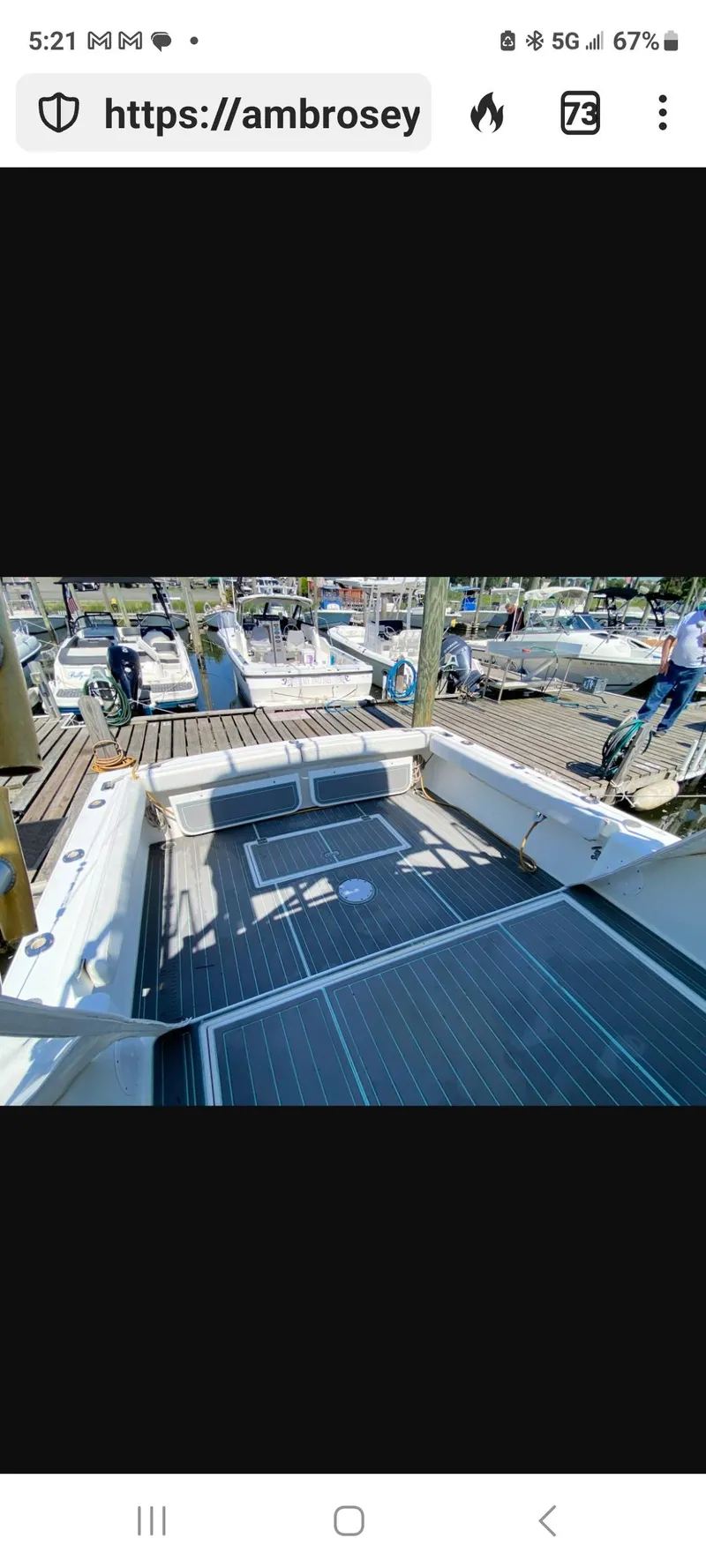 Slide: The Image of 2000 Dawson Yachts 33 EXPRESS deck view at marina, showcasing spacious layout. - 21