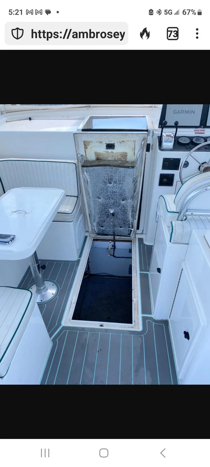 Slide: The Image of Interior view of a 2000 Dawson Yachts 33 EXPRESS, showcasing seating and control area. - 26